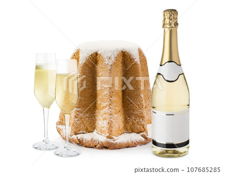 Champagne bottle with glasses and pandoro. 107685285