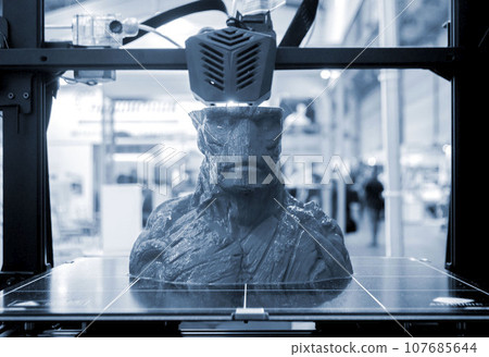 3D printer printing object close-up. Process creating three-dimensional model on 3d printer. Additive printer technology. 3D Prototyping. 3D design modeling. New modern innovation printing technology 107685644
