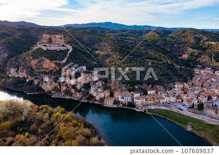 Catalan town of Miravet on banks of Ebro river, Tarragona, Spain Catalan town of Miravet on banks of Ebro river, Tarragona, Spain 107689837