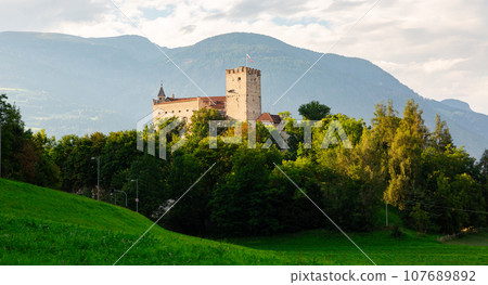 View of Bruneck Castle, situated on the hill over old town, in Val Pusteria, Italy 107689892