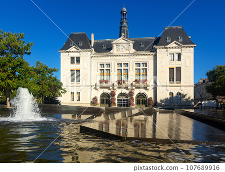 Montlucon City hall decorated with flowers and fountain in front of entrance 107689916