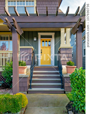 A perfect neighbourhood. Porch and entrance of a nice residential house 107690736
