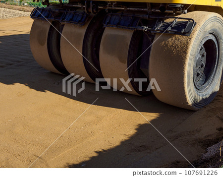 Road construction_Scenery of foundation work and heavy machinery Road construction_Scenery of foundation work and heavy machinery 107691226
