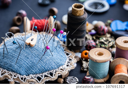 Pins, retro threads and beads 107691317