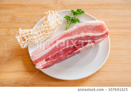 Pork belly block meat and net 107691825
