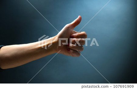 Hand shows signs with fingers Hand shows signs with fingers 107691909
