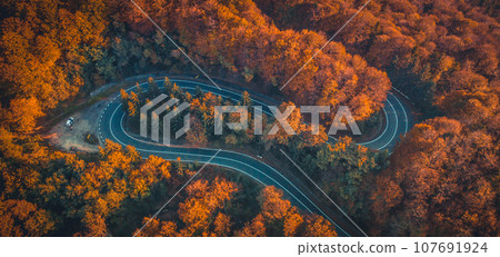 Transfagarasan serpentine going through forest Transfagarasan serpentine going through forest 107691924