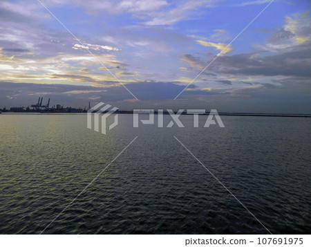 View from the boat to the seaport at sunset, Odessa, UA. High quality photo View from the boat to the seaport at sunset, Odessa, UA. High quality photo 107691975