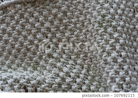 Various knots of macrame technique made of white threads 107692115