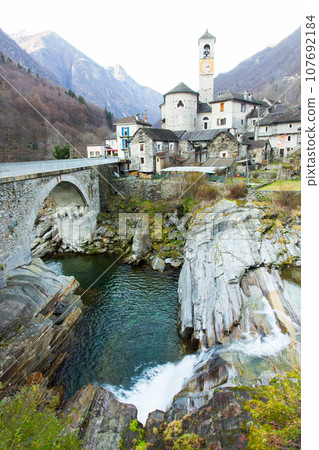 River, bridge, buildings in the town of Lavertezzo. Switzerland. Alps River, bridge, buildings in the town of Lavertezzo. Switzerland. Alps 107692184