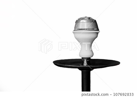 White clay hookah bowl smoking object on isolated background close-up White clay hookah bowl smoking object on isolated background close-up 107692833