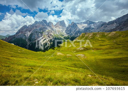 landscape with mountains, hills and clouds landscape with mountains, hills and clouds 107693615
