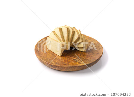 Tofu Cheese Isolated, Smoked Vegan Cheese Slice, Sliced Soya Bean Curd, Soy Protein or TSP Tofu Cheese Isolated, Smoked Vegan Cheese Slice, Sliced Soya Bean Curd, Soy Protein or TSP 107694253
