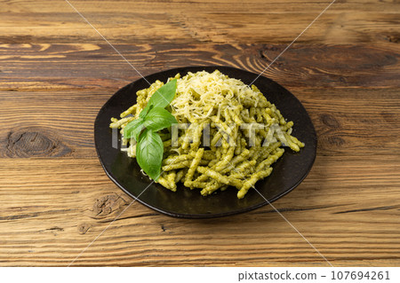 Trofie Al Pesto, Italian Pasta with Pesto Sauce, Traditional Genovese Troffie, Fusilli Pugliesi, Liguria Food Trofie Al Pesto, Italian Pasta with Pesto Sauce, Traditional Genovese Troffie, Fusilli Pugliesi, Liguria Food 107694261