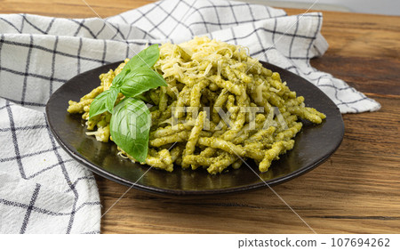 Trofie Al Pesto, Italian Pasta with Pesto Sauce, Traditional Genovese Troffie, Fusilli Pugliesi, Liguria Food Trofie Al Pesto, Italian Pasta with Pesto Sauce, Traditional Genovese Troffie, Fusilli Pugliesi, Liguria Food 107694262