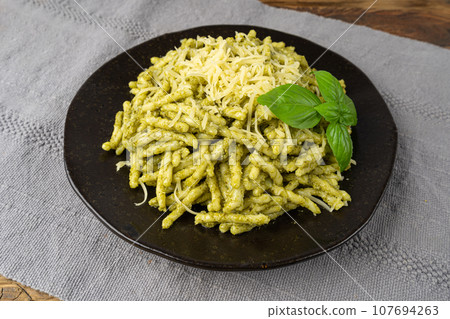 Trofie Al Pesto, Italian Pasta with Pesto Sauce, Traditional Genovese Troffie, Fusilli Pugliesi, Liguria Food Trofie Al Pesto, Italian Pasta with Pesto Sauce, Traditional Genovese Troffie, Fusilli Pugliesi, Liguria Food 107694263