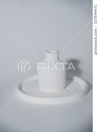 Small white ceramic vase.handmade symbolic ceramic figurines.Cozy home natural eco decor Small white ceramic vase.handmade symbolic ceramic figurines.Cozy home natural eco decor 107694471