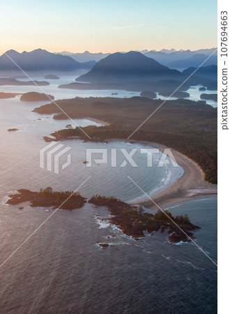 Rocky Shore on the Pacific Ocean Coast in Tofino, Vancouver Island, BC, Canada. Sunset. Aerial Rocky Shore on the Pacific Ocean Coast in Tofino, Vancouver Island, BC, Canada. Sunset. Aerial 107694663