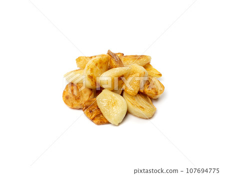 Fried Garlic Cloves Pile Isolated on White Background 107694775