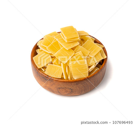 Small Square Pasta, Quadrucci Raw Pasta, Flat Dry Macaroni, Mediterranean Cuisine, Soup Ingredient Small Square Pasta, Quadrucci Raw Pasta, Flat Dry Macaroni, Mediterranean Cuisine, Soup Ingredient 107696493