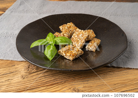 Sunflower Seeds Bar on Black Plate, Energy Snack with Honey, Sun Flower Seed Muesli Dessert 107696502