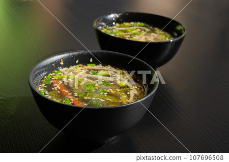 Fish Broth with Greens, Sesame Seeds and Herbs Fish Broth with Greens, Sesame Seeds and Herbs 107696508