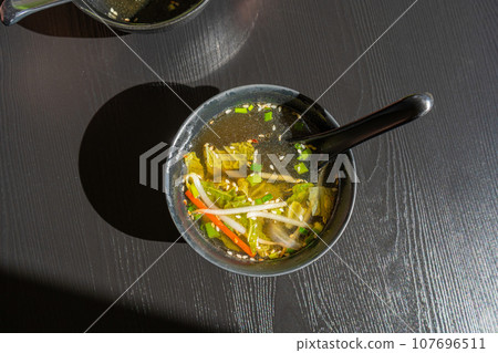 Fish Broth with Greens, Sesame Seeds and Herbs Fish Broth with Greens, Sesame Seeds and Herbs 107696511