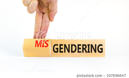 Gendering or misgendering symbol. Concept words Gendering Misgendering on wooden blocks. Beautiful white background. Psychologist hand. Gendering or misgendering concept. Copy space. Gendering or misgendering symbol. Concept words Gendering Misgendering on wooden blocks. Beautiful white background. Psychologist hand. Gendering or misgendering concept. Copy space. 107696647