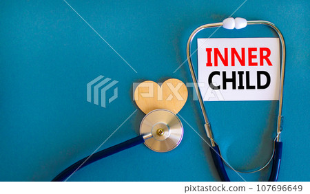 Inner child symbol. Concept words Inner child on beautiful white card. Beautiful blue table blue background. Stethoscope heart icon. Psychological, motivational inner child concept. Copy space. Inner child symbol. Concept words Inner child on beautiful white card. Beautiful blue table blue background. Stethoscope heart icon. Psychological, motivational inner child concept. Copy space. 107696649