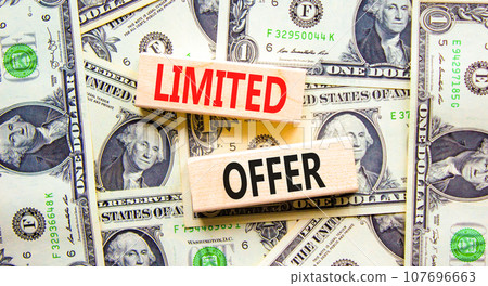 Limited offer symbol. Concept words Limited offer on beautiful wooden block. Beautiful background from dollar bills. Dollar bills. Business marketing, motivational Limited offer concept. Copy space. Limited offer symbol. Concept words Limited offer on beautiful wooden block. Beautiful background from dollar bills. Dollar bills. Business marketing, motivational Limited offer concept. Copy space. 107696663