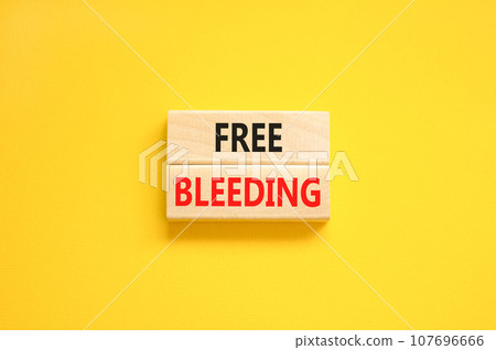 Free bleeding symbol. Concept words Free bleeding on beautiful wooden block. Beautiful yellow table yellow background. Gen Z, motivational, freedom free bleeding concept. Copy space. Free bleeding symbol. Concept words Free bleeding on beautiful wooden block. Beautiful yellow table yellow background. Gen Z, motivational, freedom free bleeding concept. Copy space. 107696666