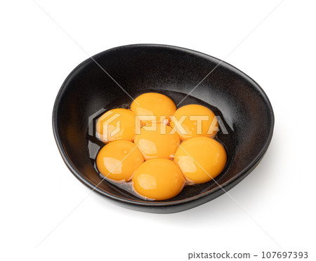 Egg Yolks in Bowl, Fresh Chicken Egg Yolk Separated from Whites for Cooking Recipe, Organic Yolks Top View Egg Yolks in Bowl, Fresh Chicken Egg Yolk Separated from Whites for Cooking Recipe, Organic Yolks Top View 107697393
