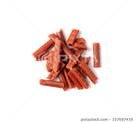 Fish Jerky Isolated, Dry Salted Seafood Snack, Hake Stockfish, Small Pieces of Dehydrated Pollock Fish Jerky Isolated, Dry Salted Seafood Snack, Hake Stockfish, Small Pieces of Dehydrated Pollock 107697439