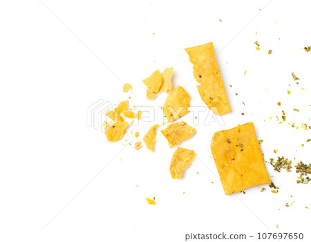 Crumbled Pita Chips Isolated, Broken Tortillas, Crunchy Flat Bread Crumbs, Pita Chips on White Background 107697650