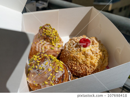 Doughnuts in Paper Box, Fruit Raspberry Donut, Pistachio Croissant Collection Doughnuts in Paper Box, Fruit Raspberry Donut, Pistachio Croissant Collection 107698418