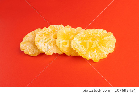 Dry Pineapple Rings Isolated, Candy Pineapples, Dehydrated Yellow Sugar Fruit, Candied Fruits Circles 107698454