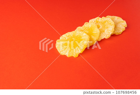 Dry Pineapple Rings Isolated, Candy Pineapples, Dehydrated Yellow Sugar Fruit, Candied Fruits Circles 107698456