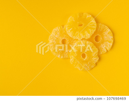 Dry Pineapple Rings Isolated, Candy Pineapples, Dehydrated Yellow Sugar Fruit, Candied Fruits Circles 107698469