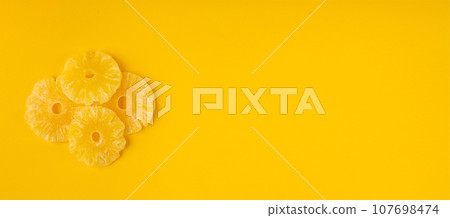 Dry Pineapple Rings Isolated, Candy Pineapples, Dehydrated Yellow Sugar Fruit, Candied Fruits Circles 107698474