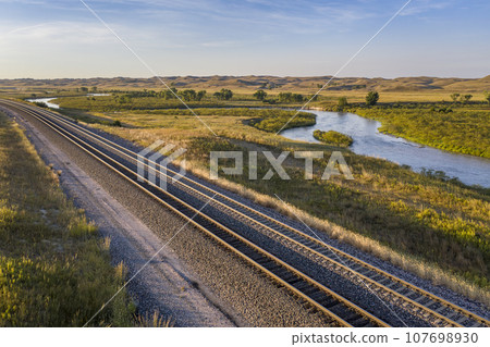 highway and railroad across Nebraska Sandhills along the Middle Loup River, aerial view highway and railroad across Nebraska Sandhills along the Middle Loup River, aerial view 107698930