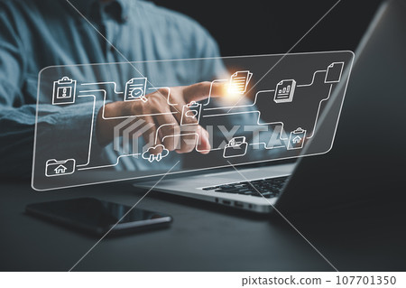 Businesswoman pointing to a virtual modern screen displaying Document Management System (DMS). Concept of digital file management and efficient information handling. Internet-based technology. 107701350