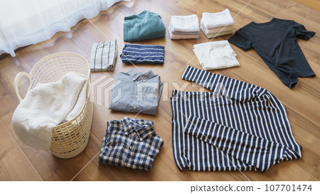 Image of folding laundry 107701474