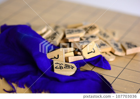 shogi pieces on the shogi board shogi pieces on the shogi board 107703036