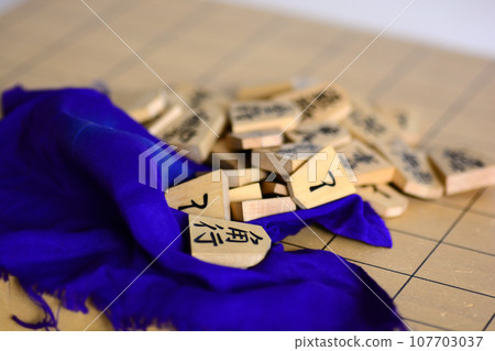 shogi pieces on the shogi board shogi pieces on the shogi board 107703037