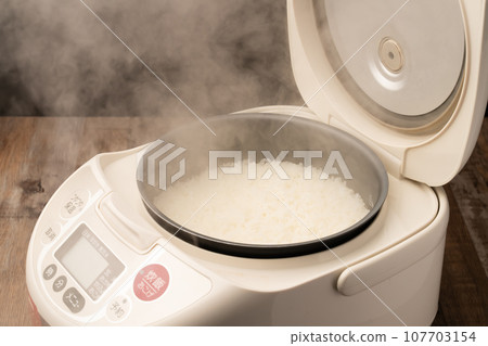Rice cooker freshly cooked rice 107703154