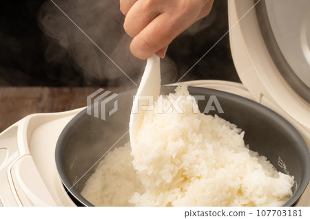 Rice cooker freshly cooked rice 107703181