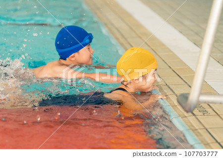 Kids swimming 107703777