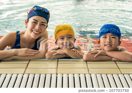 swimming coach and kids swimming swimming coach and kids swimming 107703788