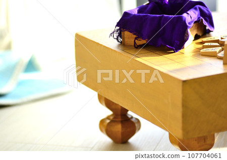 Shogi board and shogi pieces placed in a bright room Shogi board and shogi pieces placed in a bright room 107704061