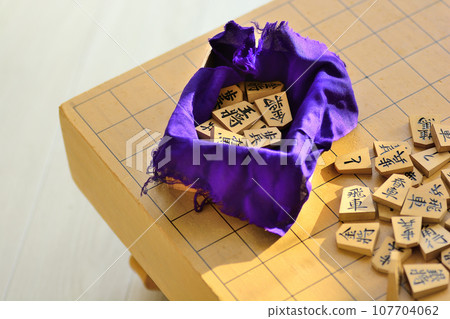 Shogi board and shogi pieces placed in a bright room Shogi board and shogi pieces placed in a bright room 107704062